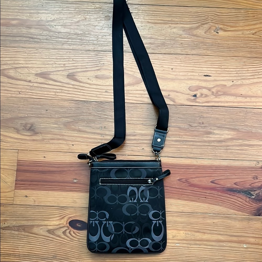 Black Crossbody Bag with Adjustable Strap and Designer Pattern
